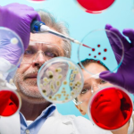 Scientists analysing petri dishes filled with colourful bacterial cultures in a laboratory setting